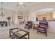 Open floor plan with comfortable seating, dining area, and inviting kitchen at 17939 N Encanto Dr, Surprise, AZ 85374