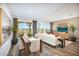 Bright living space with a dining area, modern decor, and large windows that provide great natural light and views of the patio at 17995 W Sand Hills Rd, Surprise, AZ 85387