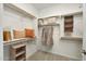 Spacious walk-in closet with shelving and storage options, providing ample space to organize clothes and personal items at 17995 W Sand Hills Rd, Surprise, AZ 85387