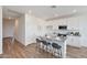 Bright kitchen with white cabinets, granite counters, stainless steel appliances and breakfast bar at 18009 W Sand Hills Rd, Surprise, AZ 85387