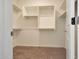 Spacious walk-in closet with ample shelving and storage space at 18009 W Sand Hills Rd, Surprise, AZ 85387