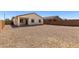 A large desert landscaped backyard offering low-maintenance living and privacy at 238 W Kona Dr, Casa Grande, AZ 85122