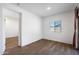 Bedroom with light-colored wood floors and natural light from a window at 238 W Kona Dr, Casa Grande, AZ 85122