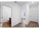 Hallway with white walls, and a half-bathroom with tile floors is visible at 238 W Kona Dr, Casa Grande, AZ 85122