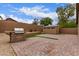 Backyard features a stone outdoor kitchen, barbecue, and outdoor shed at 2629 E Beverly Rd, Phoenix, AZ 85042