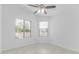 Bright bedroom with neutral walls, tile floor, and a window with natural light at 2629 E Beverly Rd, Phoenix, AZ 85042