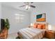 Stylish bedroom featuring a bed, side tables, decorative artwork, and a TV at 2629 E Beverly Rd, Phoenix, AZ 85042