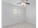 Clean bedroom with a window bringing in natural light and white walls at 2629 E Beverly Rd, Phoenix, AZ 85042