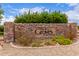 Attractive stone entrance sign to The Groves at South Mountain, surrounded by colorful flowers and greenery at 2629 E Beverly Rd, Phoenix, AZ 85042