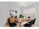 Dining room with modern lighting, stylish decor, and a window providing natural light at 2629 E Beverly Rd, Phoenix, AZ 85042