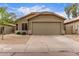 Charming single-story home with a tile roof, desert landscaping, and a spacious two-car garage at 2629 E Beverly Rd, Phoenix, AZ 85042