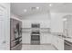 Modern kitchen with stainless steel appliances, granite countertops, and ample cabinet space at 2629 E Beverly Rd, Phoenix, AZ 85042
