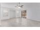 Bright living room features neutral decor, a ceiling fan, and sliding glass doors to the backyard patio at 2629 E Beverly Rd, Phoenix, AZ 85042