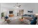 Bright living room features neutral decor, a ceiling fan, and sliding glass doors to the backyard patio at 2629 E Beverly Rd, Phoenix, AZ 85042