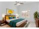 Spacious main bedroom with a ceiling fan, a window providing natural light, and stylish furnishings at 2629 E Beverly Rd, Phoenix, AZ 85042