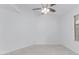 Bright room features neutral decor, a ceiling fan, and a window providing natural light at 2629 E Beverly Rd, Phoenix, AZ 85042