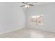 Bright room features neutral decor, a ceiling fan, and a window providing natural light at 2629 E Beverly Rd, Phoenix, AZ 85042