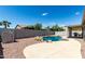 Private backyard with pool, rock features, and ample space for outdoor seating at 30 S 230Th Ave, Buckeye, AZ 85326