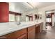 A spacious bathroom with a long vanity and tile flooring at 30 S 230Th Ave, Buckeye, AZ 85326
