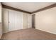 Bedroom with a window, closet and neutral wall and carpet colors at 30 S 230Th Ave, Buckeye, AZ 85326