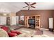 Spacious living room with a tall ceiling, a wooden media center, and a decorative rug at 30 S 230Th Ave, Buckeye, AZ 85326
