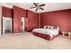 A spacious primary bedroom with an ensuite bathroom and neutral carpeting at 30 S 230Th Ave, Buckeye, AZ 85326
