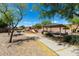 Community playground and picnic area with mature trees and ample seating at 30 S 230Th Ave, Buckeye, AZ 85326