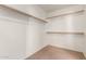Spacious walk-in closet with multiple racks ready for organization at 30 S 230Th Ave, Buckeye, AZ 85326