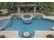 Stunning aerial view of the pool area with spa, fire features, and lush landscaping at 3011 E Morrison Ranch Pkwy, Gilbert, AZ 85296
