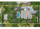 An aerial view of a sprawling property with a large pool, lush landscaping, and expansive living spaces at 3011 E Morrison Ranch Pkwy, Gilbert, AZ 85296