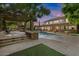 Expansive backyard with a pool, spa, and covered patio with an outdoor fireplace at 3011 E Morrison Ranch Pkwy, Gilbert, AZ 85296