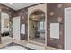 Elegant bathroom with a glass-enclosed shower, soaking tub, and stylish design features at 3011 E Morrison Ranch Pkwy, Gilbert, AZ 85296