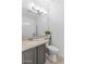 Modern bathroom with a sleek vanity, updated fixtures, and a convenient toilet area at 3011 E Morrison Ranch Pkwy, Gilbert, AZ 85296