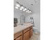 Bathroom features a sink with a marble countertop and modern vanity lighting at 3011 E Morrison Ranch Pkwy, Gilbert, AZ 85296