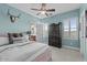 Comfortable bedroom with a ceiling fan, an ensuite bathroom, and plantation shutters at 3011 E Morrison Ranch Pkwy, Gilbert, AZ 85296