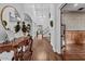 Elegant foyer with hardwood floors, a chandelier, a curved staircase, and decorative accents at 3011 E Morrison Ranch Pkwy, Gilbert, AZ 85296