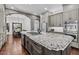 Gourmet kitchen with stainless steel appliances, granite countertops, and large island at 3011 E Morrison Ranch Pkwy, Gilbert, AZ 85296