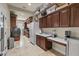 Functional laundry room with ample storage, sink, and modern washer/dryer at 3011 E Morrison Ranch Pkwy, Gilbert, AZ 85296