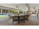 Spacious covered patio with comfortable seating overlooking the pool and backyard at 3011 E Morrison Ranch Pkwy, Gilbert, AZ 85296