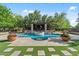 Gorgeous pool area featuring a spa and outdoor fireplace for upscale entertaining at 3011 E Morrison Ranch Pkwy, Gilbert, AZ 85296