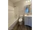 Clean bathroom offers a bathtub with shower, toilet, and vanity with white cabinets at 3150 E Corrine Dr, Phoenix, AZ 85032