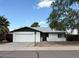 Charming single-story home featuring a two-car garage and a well-maintained front yard at 3150 E Corrine Dr, Phoenix, AZ 85032