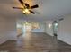 Open living room featuring wood flooring, with a view of kitchen and back patio at 3150 E Corrine Dr, Phoenix, AZ 85032