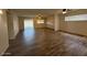 Spacious living room with new wood flooring, modern ceiling fans, and natural light at 3150 E Corrine Dr, Phoenix, AZ 85032