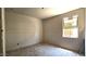 Bedroom featuring a window, drywall walls, concrete floor, and an open closet at 32123 N Lone Rancher Way, San Tan Valley, AZ 85140