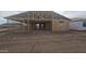New home exterior under construction featuring wood framing and large garage at 32123 N Lone Rancher Way, San Tan Valley, AZ 85140