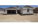 New construction home featuring attached two-car garage and unfinished landscaping at 32123 N Lone Rancher Way, San Tan Valley, AZ 85140