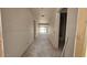 Spacious hallway with natural light, smooth concrete floor, and drywall walls at 32123 N Lone Rancher Way, San Tan Valley, AZ 85140
