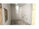 Interior view of laundry room, showcasing washer and dryer hookups and drywall walls at 32123 N Lone Rancher Way, San Tan Valley, AZ 85140