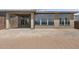 Exterior view of backyard featuring a covered patio and an empty yard at 32497 N 135Th Dr, Peoria, AZ 85383